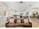 Open-concept living space with a seamless transition to the kitchen and dining area, perfect for modern living and entertaining at 3814 W Sevilla St, Tampa, FL 33629