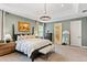 Large primary bedroom with an en-suite bathroom featuring a walk-in closet and ample natural light at 3814 W Sevilla St, Tampa, FL 33629