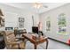 Bright office with wooden desk, leather chair, and windows at 3814 W Sevilla St, Tampa, FL 33629