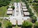 Birds-eye view reveals the complex's layout, with buildings surrounded by trees and a well-organized parking area at 4015 My Lady Ln # 7, Land O Lakes, FL 34638