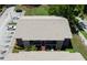 Aerial view featuring the building's roof, parking, and landscaping, showcasing its overall design at 4015 My Lady Ln # 7, Land O Lakes, FL 34638