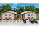 The building features a two-story apartment with parking and landscaping visible at 4015 My Lady Ln # 7, Land O Lakes, FL 34638