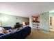 Cozy living room with view of the dining area, kitchen bar, and nearby bathroom at 4015 My Lady Ln # 7, Land O Lakes, FL 34638