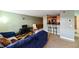 Comfortable living room with view of the dining area, kitchen bar, and nearby bathroom at 4015 My Lady Ln # 7, Land O Lakes, FL 34638