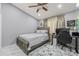 Cozy bedroom features a ceiling fan, a workspace and a neutral color palette at 417 Manor Blvd, Palm Harbor, FL 34683