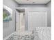 Bedroom featuring a large art piece, LVT floors and large closets for storage at 417 Manor Blvd, Palm Harbor, FL 34683