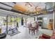 Large garage space with workout equipment, kitchen appliances, and multiple ceiling fans at 417 Manor Blvd, Palm Harbor, FL 34683