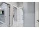 Hallway with marble floors provides access to bedroom, bathroom, and storage at 417 Manor Blvd, Palm Harbor, FL 34683