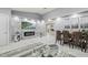 Modern living room with marble floors, sleek fireplace, stylish decor, and a dining area for sophisticated living at 417 Manor Blvd, Palm Harbor, FL 34683