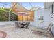 An inviting outdoor dining space with patio furniture and covered shade for gatherings at 417 Manor Blvd, Palm Harbor, FL 34683