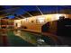 The pool area at night, lit up and ready for an evening swim or relaxation at 417 Manor Blvd, Palm Harbor, FL 34683