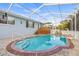 A screened-in pool with cool, refreshing water and ample space for relaxation at 417 Manor Blvd, Palm Harbor, FL 34683
