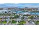 An aerial perspective showcases an attractive coastal community, highlighting marina access, waterfront homes, and scenic views at 425 4Th N Ave, Tierra Verde, FL 33715