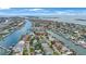 Stunning aerial view of waterfront homes with docks, lush landscaping, and access to beautiful waterways and ocean at 425 4Th N Ave, Tierra Verde, FL 33715