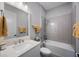 Bathroom with tub and shower combination, vanity, and stylish fixtures at 425 4Th N Ave, Tierra Verde, FL 33715