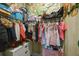 Well-organized walk-in closet with ample hanging space, shelves, and drawers, perfect for storage at 425 4Th N Ave, Tierra Verde, FL 33715