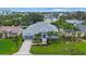 Well-maintained home with beautiful landscaping, palm trees, and a cozy front porch, presenting a welcoming curb appeal at 425 4Th N Ave, Tierra Verde, FL 33715
