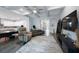Open-concept living room with coffered ceiling, hardwood floors, and easy access to the kitchen at 425 4Th N Ave, Tierra Verde, FL 33715