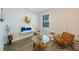Comfortable seating area featuring hardwood floors, an eye-catching modern fireplace, and neutral paint at 425 4Th N Ave, Tierra Verde, FL 33715