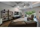 Inviting living room featuring coffered ceiling, hardwood floors, and easy access to the lanai at 425 4Th N Ave, Tierra Verde, FL 33715