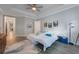Spacious main bedroom with hardwood floors, large windows, and ceiling fan at 425 4Th N Ave, Tierra Verde, FL 33715
