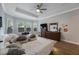 Spacious main bedroom with hardwood floors, large windows, ceiling fan, and walk in closet at 425 4Th N Ave, Tierra Verde, FL 33715