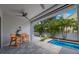 Outdoor poolside patio area offering a serene retreat, complete with a small pool and tropical landscaping at 425 4Th N Ave, Tierra Verde, FL 33715