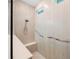 Accessible walk-in shower features modern tile work, built-in bench, and handrails for added safety at 425 4Th N Ave, Tierra Verde, FL 33715