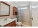 Bathroom with sink, vanity, toilet, and shower at 427 Pelican S Dr, Oldsmar, FL 34677