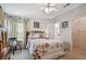 Serene bedroom with cozy decor, wood furnishings, and access to an en-suite bathroom at 427 Pelican S Dr, Oldsmar, FL 34677