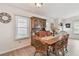 Inviting dining room featuring a wooden table set, classic china cabinet, and bright natural light at 427 Pelican S Dr, Oldsmar, FL 34677