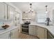 Kitchen featuring modern cabinets, a double oven, and lots of natural light at 427 Pelican S Dr, Oldsmar, FL 34677