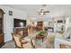 Spacious living room seamlessly connects to the dining area, offering a modern and open feel at 427 Pelican S Dr, Oldsmar, FL 34677