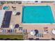 A sparkling pool with lounge chairs and umbrellas offers residents the ultimate relaxation experience at 427 Pelican S Dr, Oldsmar, FL 34677