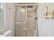 Bathroom shower with glass doors, chrome hardware, and a bright, clean interior at 427 Pelican S Dr, Oldsmar, FL 34677