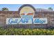 A sign displays Gull Aire Village written in big blue letters with a seagull at 427 Pelican S Dr, Oldsmar, FL 34677