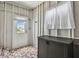 Well-lit storage area with brick flooring and practical storage solutions for an organized space at 427 Pelican S Dr, Oldsmar, FL 34677