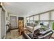 Bright sunroom featuring lots of light, comfortable furniture, and entertainment options at 427 Pelican S Dr, Oldsmar, FL 34677