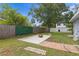 Landscaped backyard features a firepit with patio and a well maintained lawn at 4300 Maple Ne St, St Petersburg, FL 33703