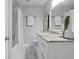 Bathroom showcasing granite vanity with marble floors and shower at 4300 Maple Ne St, St Petersburg, FL 33703