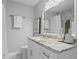 Elegant bathroom features a marble shower, and granite vanity at 4300 Maple Ne St, St Petersburg, FL 33703