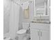 Modern bathroom featuring a marble walk-in shower and granite vanity at 4300 Maple Ne St, St Petersburg, FL 33703