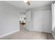 View of bedroom featuring wood floors, an entry doorway, and an oversized closet at 4300 Maple Ne St, St Petersburg, FL 33703