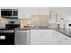 Beautiful kitchen featuring stainless steel appliances, granite countertops, and ample cabinetry at 4300 Maple Ne St, St Petersburg, FL 33703