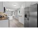 Modern kitchen featuring stainless steel appliances, white cabinetry, and sleek countertops at 4300 Maple Ne St, St Petersburg, FL 33703
