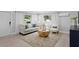 Bright living room with modern decor, large windows, and stylish furniture, creating a cozy atmosphere at 4300 Maple Ne St, St Petersburg, FL 33703
