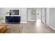 Spacious area with modern accents, including a stylish credenza and sleek wood-look flooring at 4300 Maple Ne St, St Petersburg, FL 33703