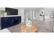 Open-concept area featuring stylish decor, leading to a modern kitchen and dining area at 4300 Maple Ne St, St Petersburg, FL 33703