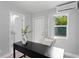 Bright office space with black desk, natural light, and modern features at 4300 Maple Ne St, St Petersburg, FL 33703