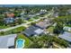 Aerial showcasing the home's backyard oasis with a private pool, landscaped yard, and proximity to nearby waterways and beaches at 4518 Helena Ne St, St Petersburg, FL 33703